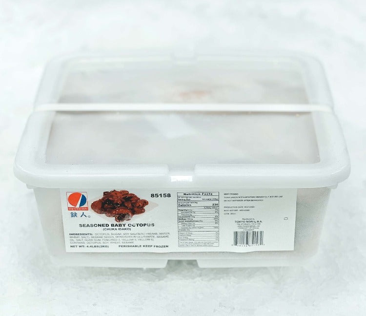 Plastic container of seasoned baby octopus (Chuka Idako) with a clear lid, placed on a bed of ice, showcasing product label and nutritional information