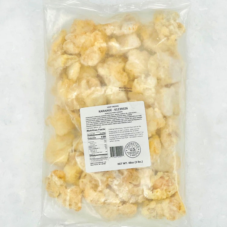 Frozen karaage chicken in a clear vacuum-sealed package with nutritional information visible. Ready to cook, perfect for quick and easy meals