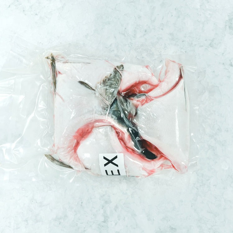 Vacuum-sealed fresh Hamachi Kama on ice, ready for cooking