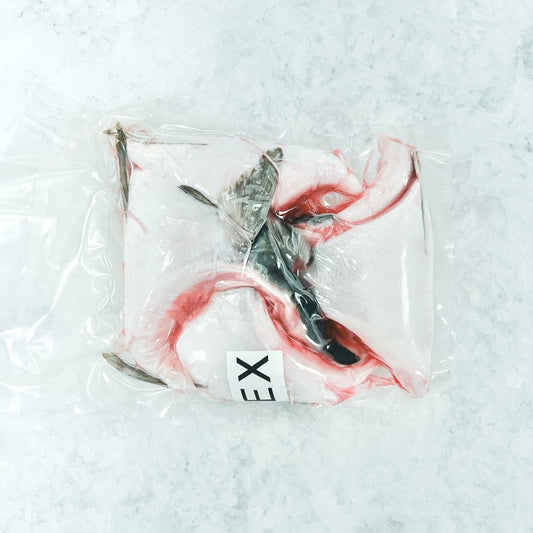 Vacuum-sealed fresh Hamachi Kama on ice, ready for cooking