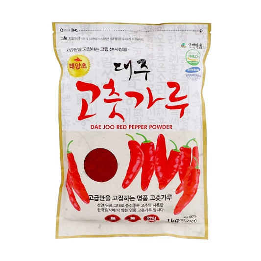 Dae Joo Red Pepper Powder packaging with bold red text and illustrations of red chili peppers, highlighting its quality