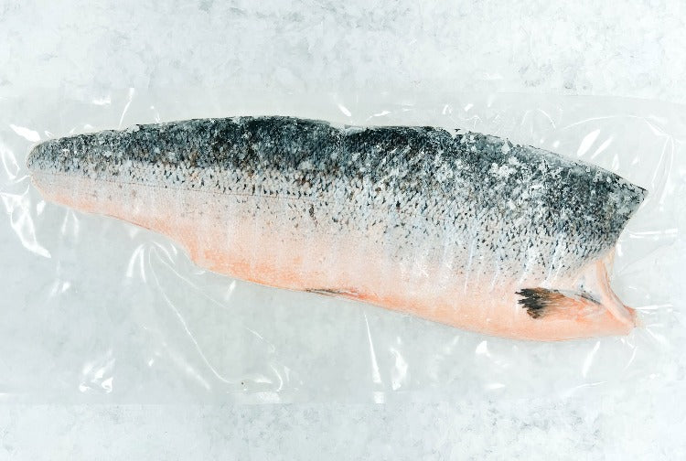 Vacuum-sealed smoked Atlantic salmon fillet, highlighting its rich color and quality