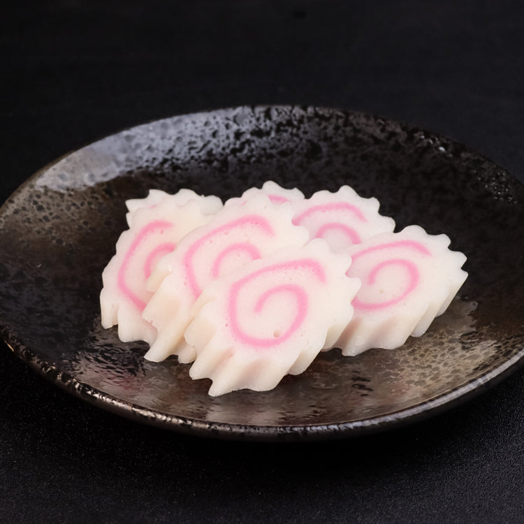 Narutomaki Fish Cake Slices on Plate - Delicious Japanese Surimi Steamed Fish Cake with Pink Swirl Design