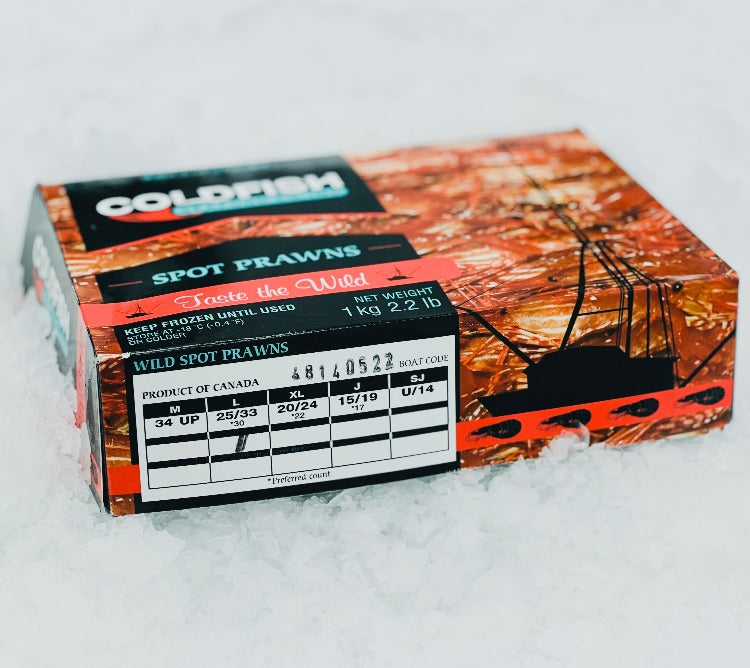Angled view of a box of Coldfish Seafood Botan Ebi (spot prawns) kept on ice, highlighting size details and boat code