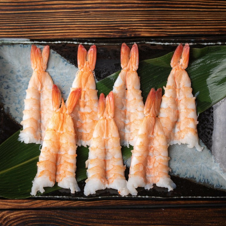 Packaged sushi ebi showing multiple shrimp in a row