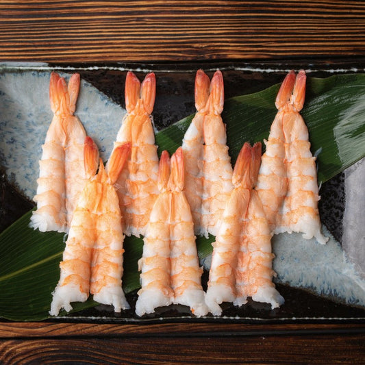 Packaged sushi ebi showing multiple shrimp in a row
