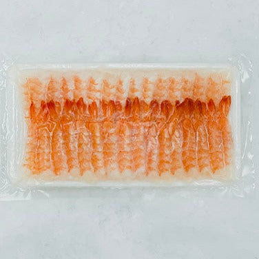 Several pieces of sushi ebi neatly arranged side by side