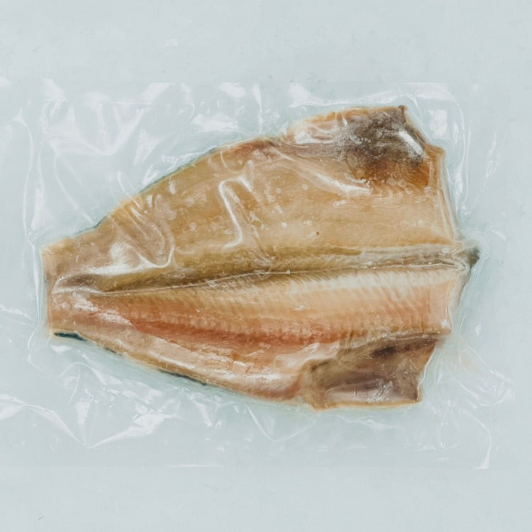 Vacuum-sealed frozen Atka mackerel fillet, showcasing the fresh quality and preparation-ready state of the fish