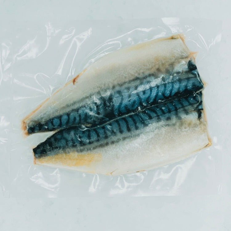 Frozen seasoned mackerel fillets in clear packaging, showcasing the natural colors and quality of the fish. Ideal for convenient and nutritious dining options