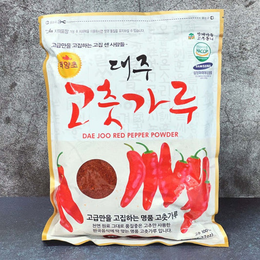 Front view of Dae Joo Red Pepper Powder packaging, showcasing vibrant red chili peppers and product name
