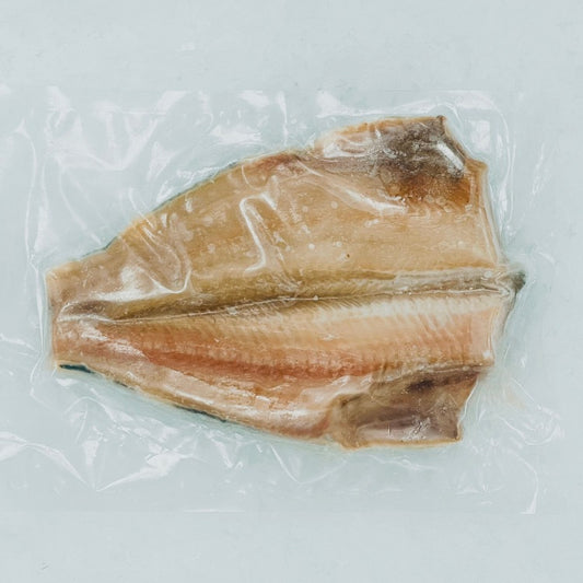 Vacuum-sealed frozen Atka mackerel fillet, showcasing the fresh quality and preparation-ready state of the fish